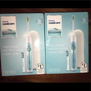 2 Sonicare Healthy White power toothbrushes